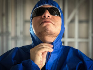 Tradie wearing Nexus Shield SMS Type 5/6 Coverall Blue from Your Safety Factory